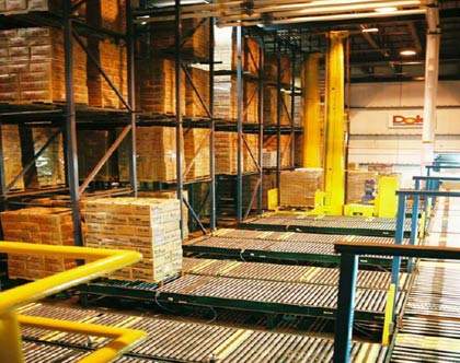 Refrigerated warehousing facility for shipping and storage of lettuce and bagged salad products.